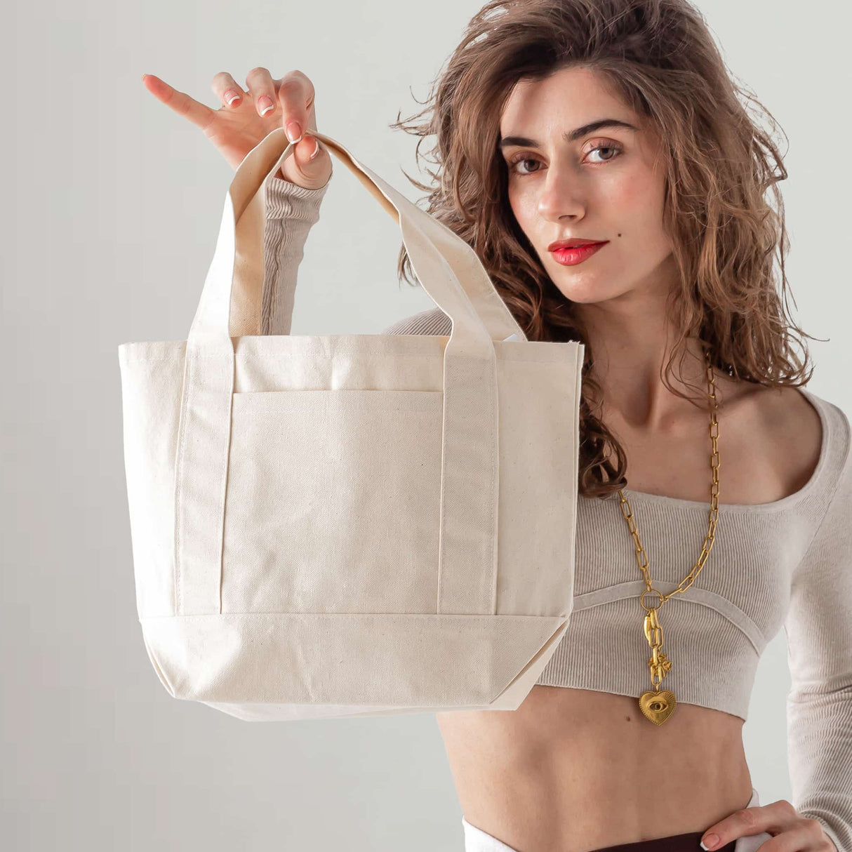 Mini Iconic Tote Model Being Held