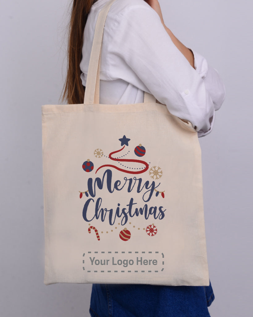 Shopping bags with designer brand names hung on Christmas tree